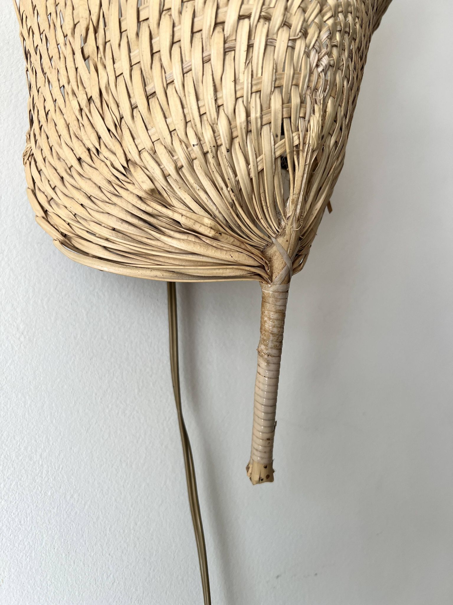 Woven rattan wall light in the style of Igno Maurer, design from the 1970s.
