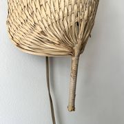 Woven rattan wall light in the style of Igno Maurer, design from the 1970s.