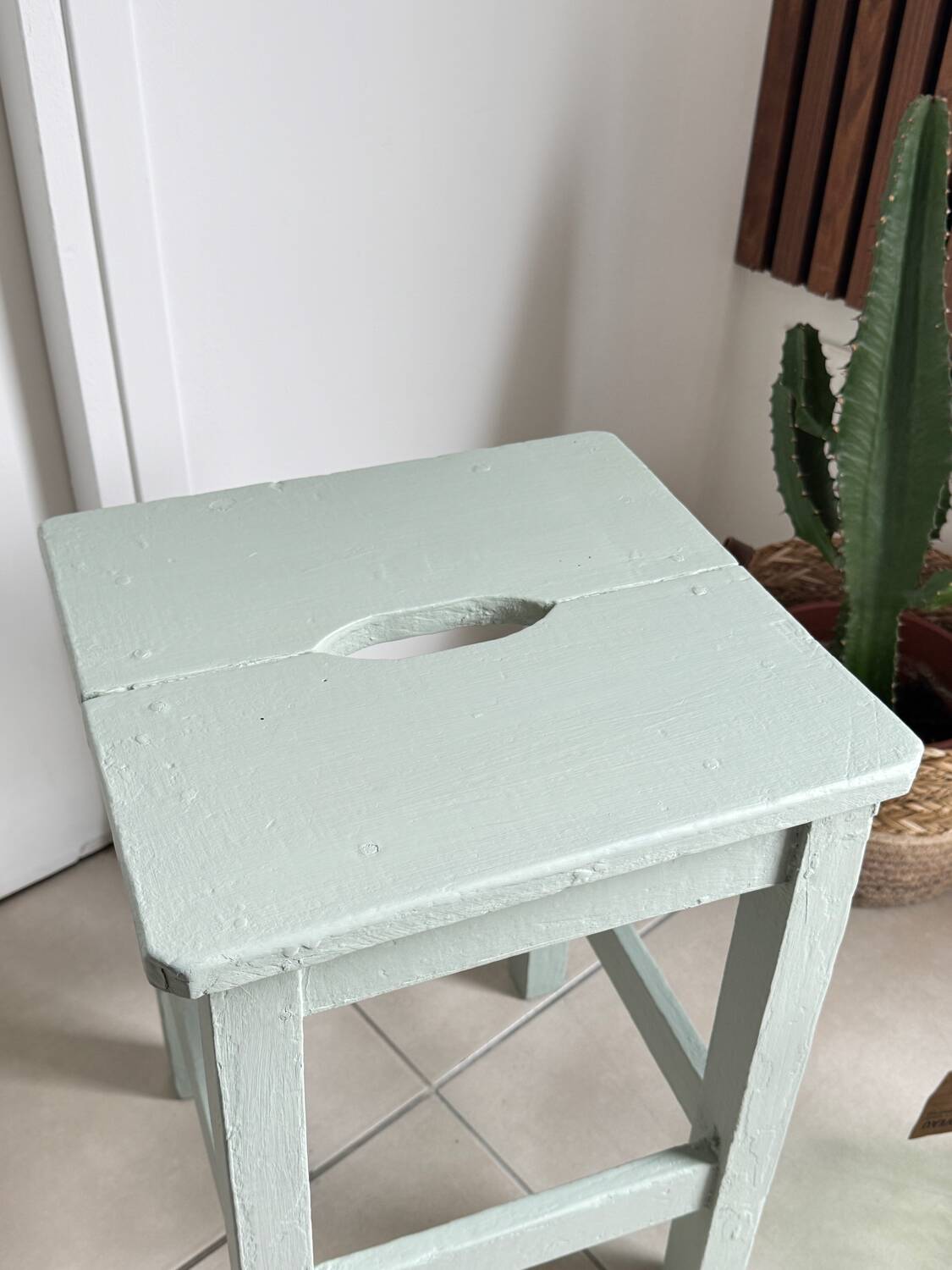 Antique almond green wooden stool