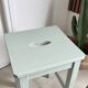 Antique almond green wooden stool