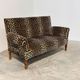 Vintage leopard velvet sofa / wall sofa with drop-down arms, France.