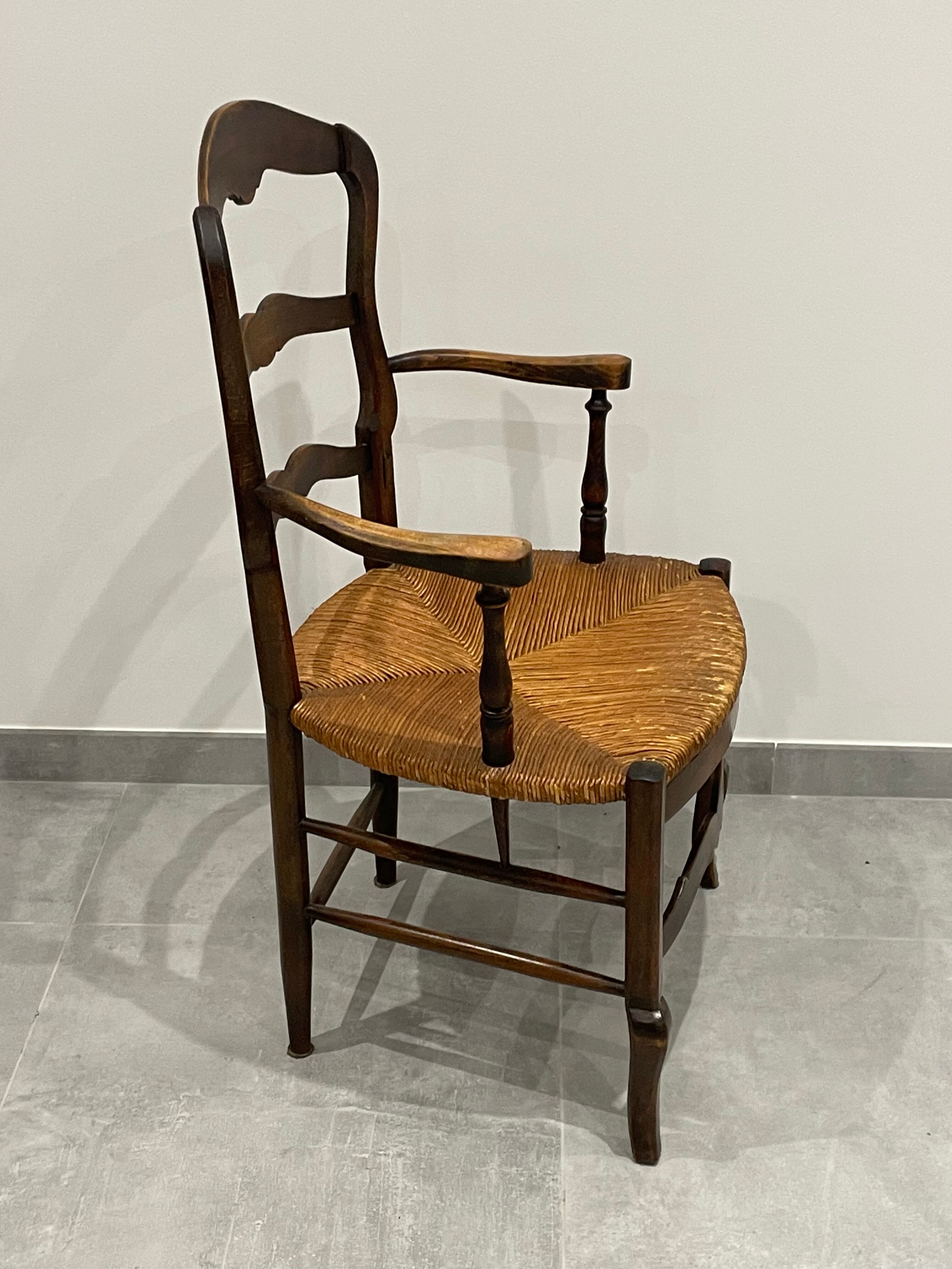 Provencal style straw armchair sometimes called marsh armchair