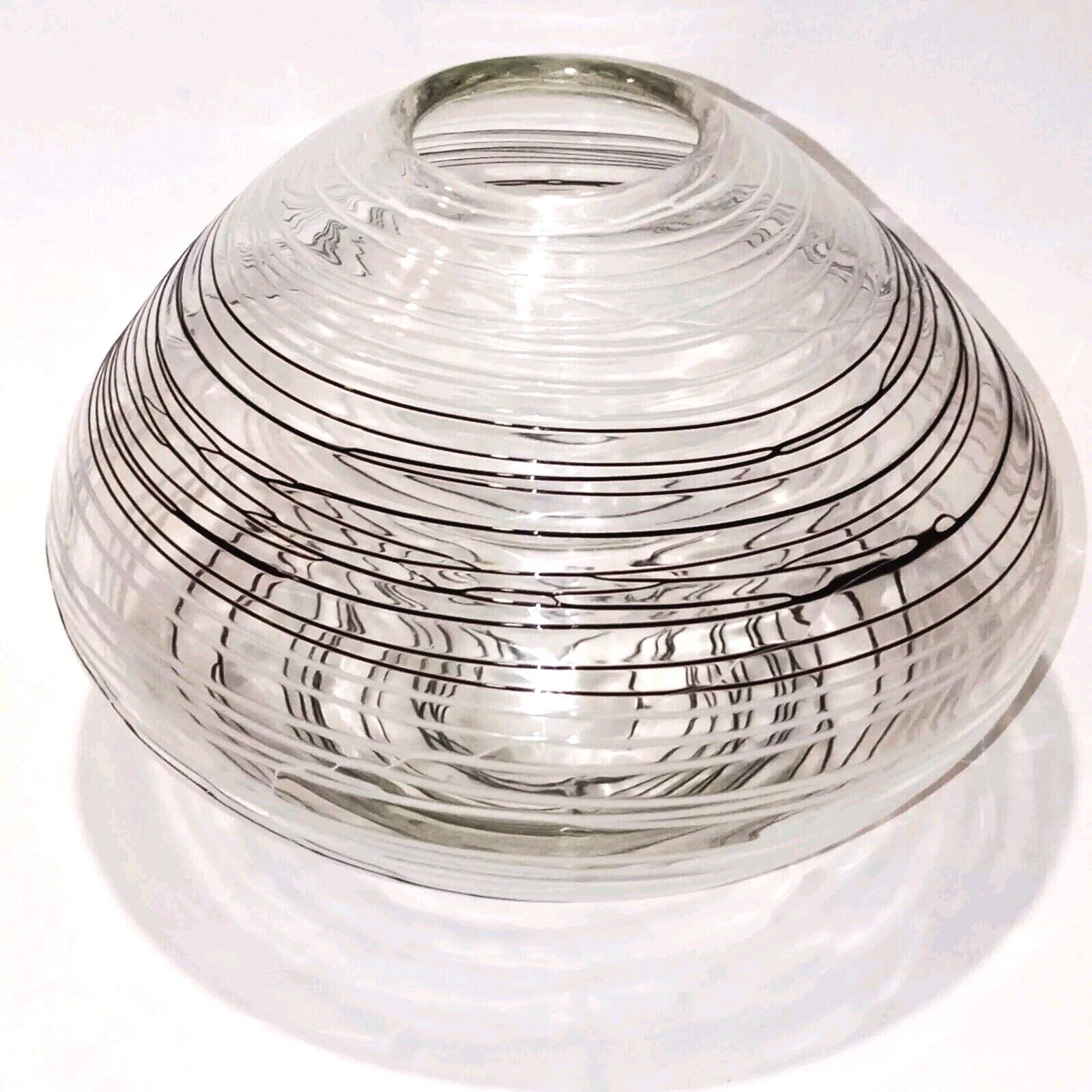 Textured oval blown glass vase with black and white glass spaghetti.