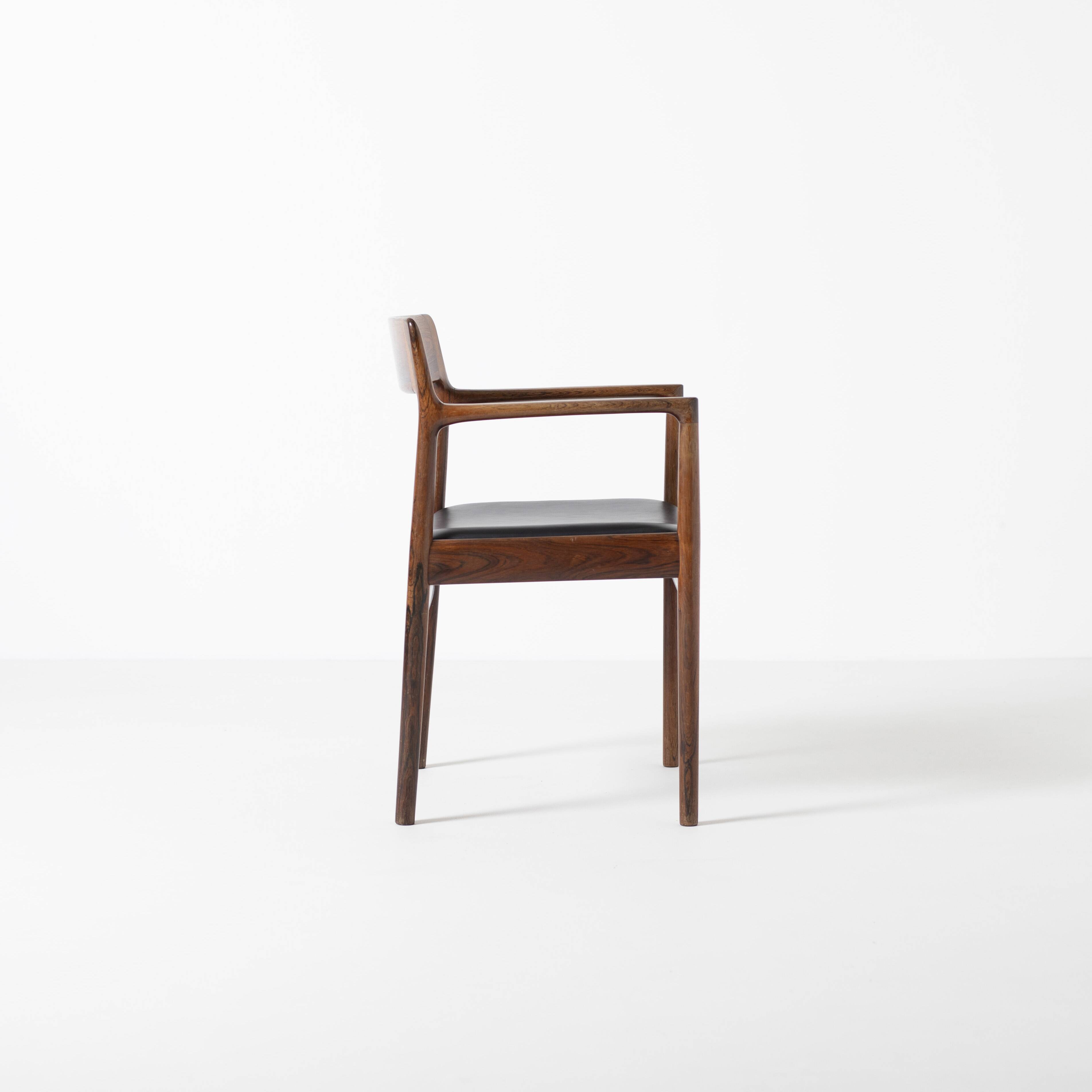 Armchair in rosewood and black leather, by J. Norgaard, Denmark, 1960s