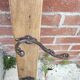antique coat rack with 3 cast iron hooks