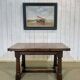 English monastery table with extensions from the late 19th century in elm and oak.
