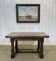 English monastery table with extensions from the late 19th century in elm and oak.