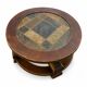 Round coffee table in stone and wood