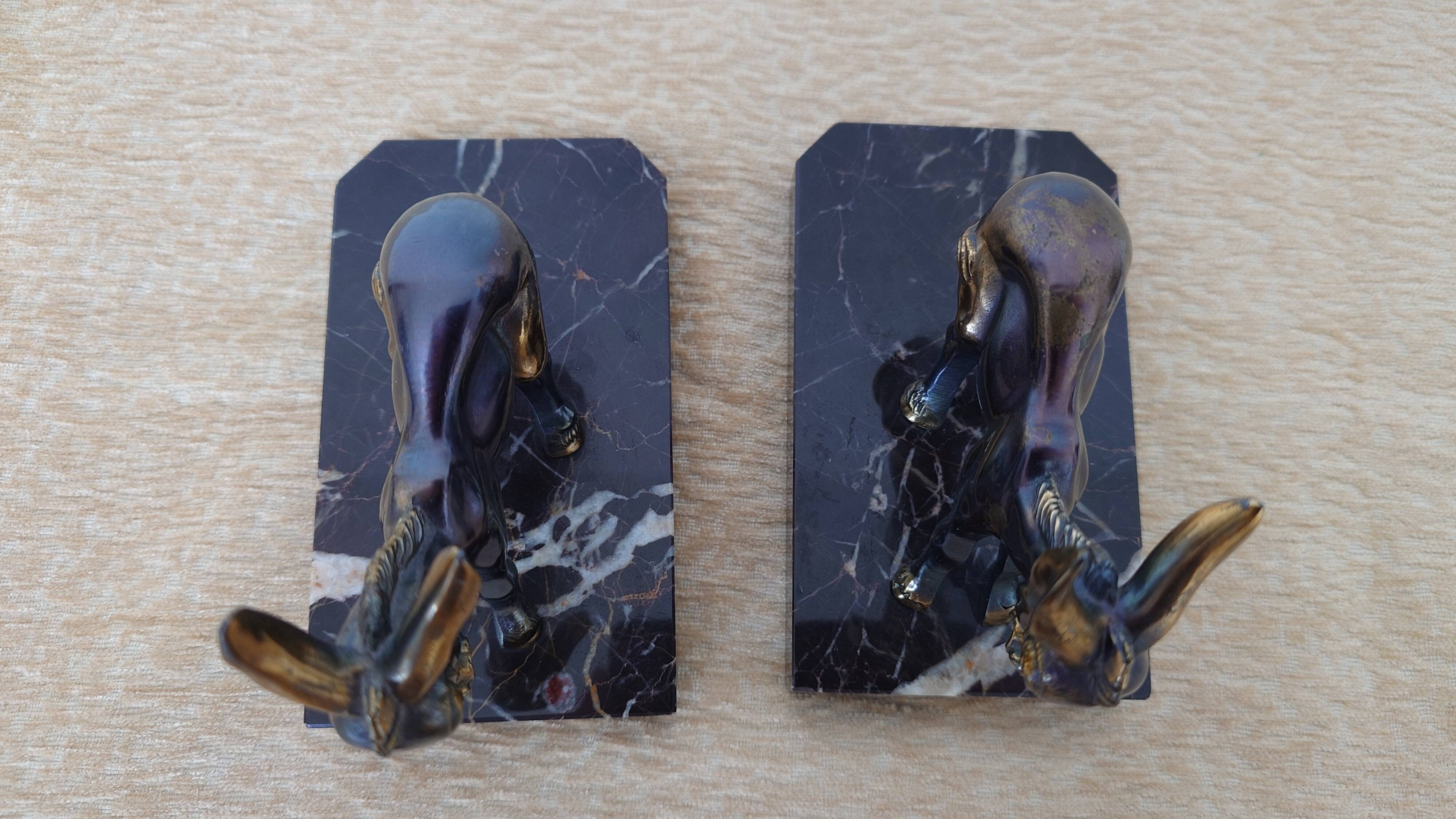 Bookends in the style of stylised donkeys, patinated metal and marble - circa 1940-1950.