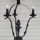 Black wrought iron floor lamp attributed to Gilbert Poillerat