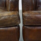 Set of 2 sturdy design armchairs made of cowhide with a beautiful deep color