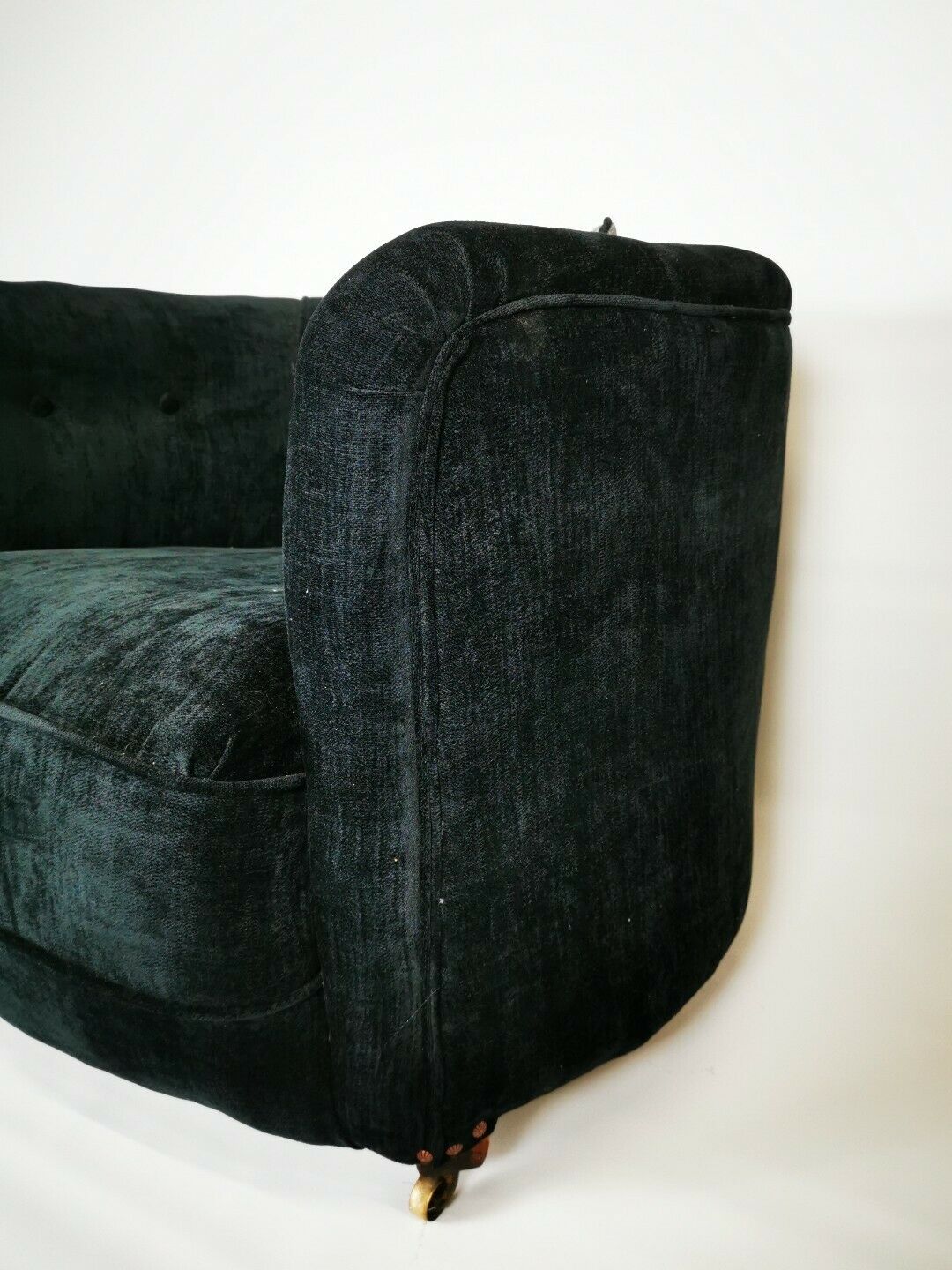 19th century black upholstered victorian tub chair on brass casters