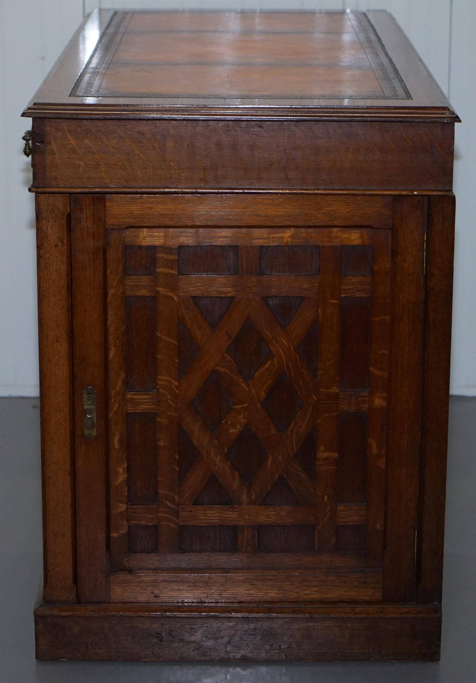 Restored Gothic desk with side bookshelves, drawer, and sloping top by Pugin Gillows.