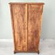 Small wooden piece of furniture, cabinet style, false drawers.