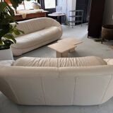 2 seater leather sofa in off-white with a rounded shape