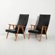 Paire de fauteuils scandinaves à dossier haut en simili cuir des années 1950-60.