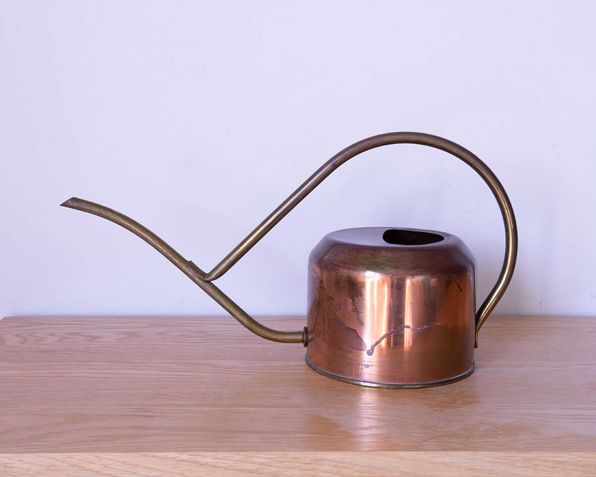 Copper and brass watering can