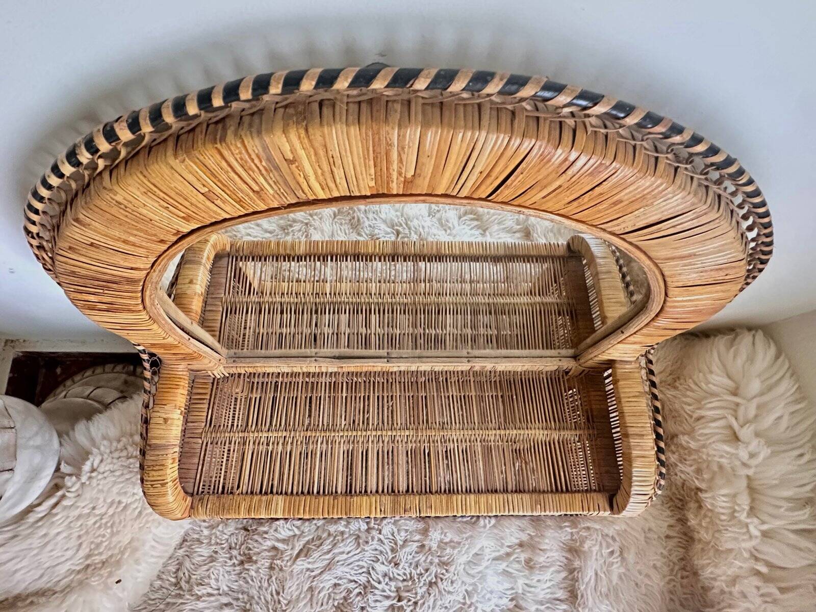 Woven rattan and wicker shelf mirror in the Emmanuelle style, Spain, 1970s.
