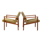 Pair of Danish teak armchairs with green upholstery