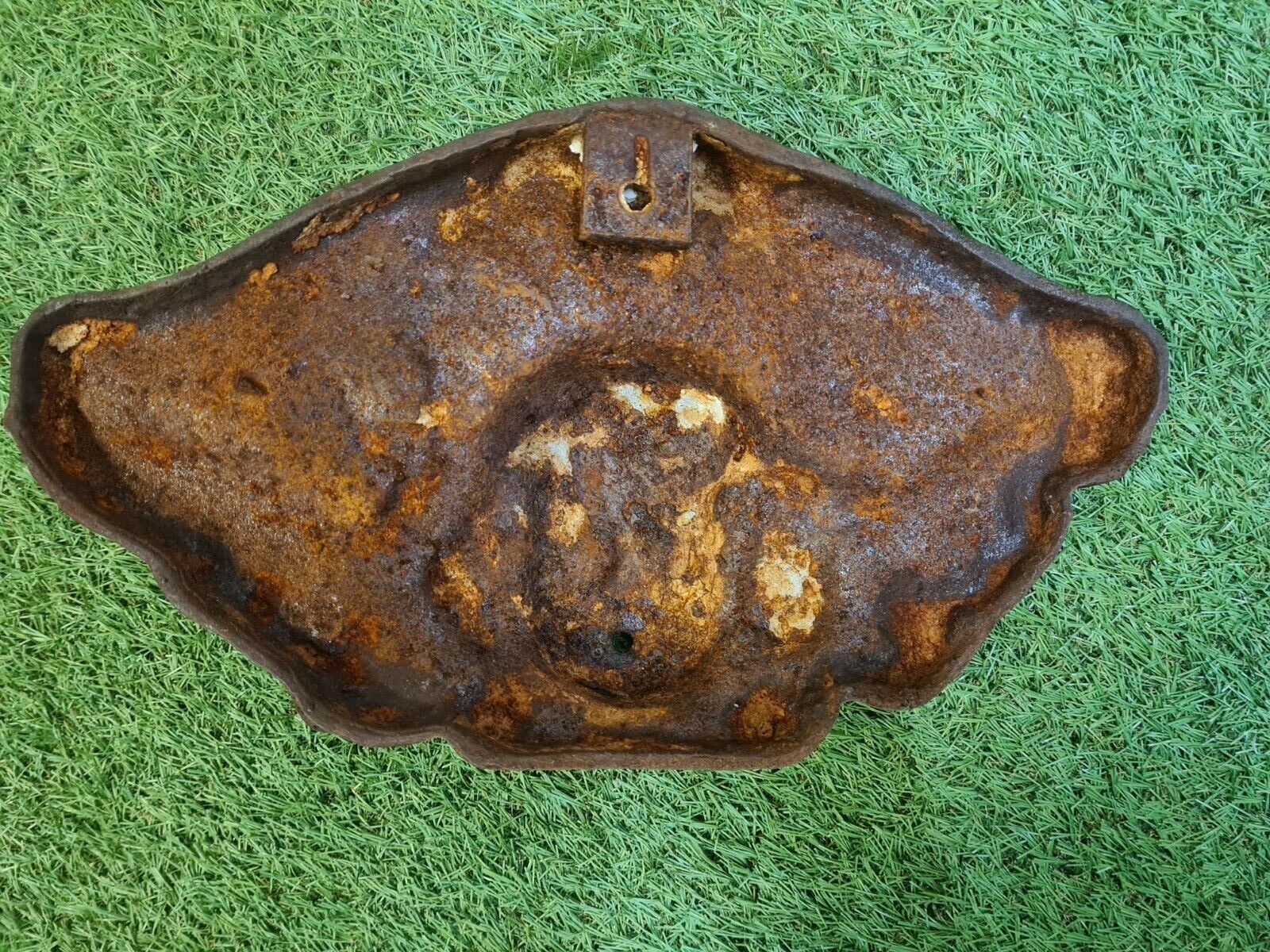 Cast iron wall fountain with a love