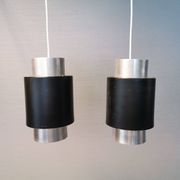 A set of beautiful cylinder shaped hanging lamps in silver color with black "ring" Danish 1970s.