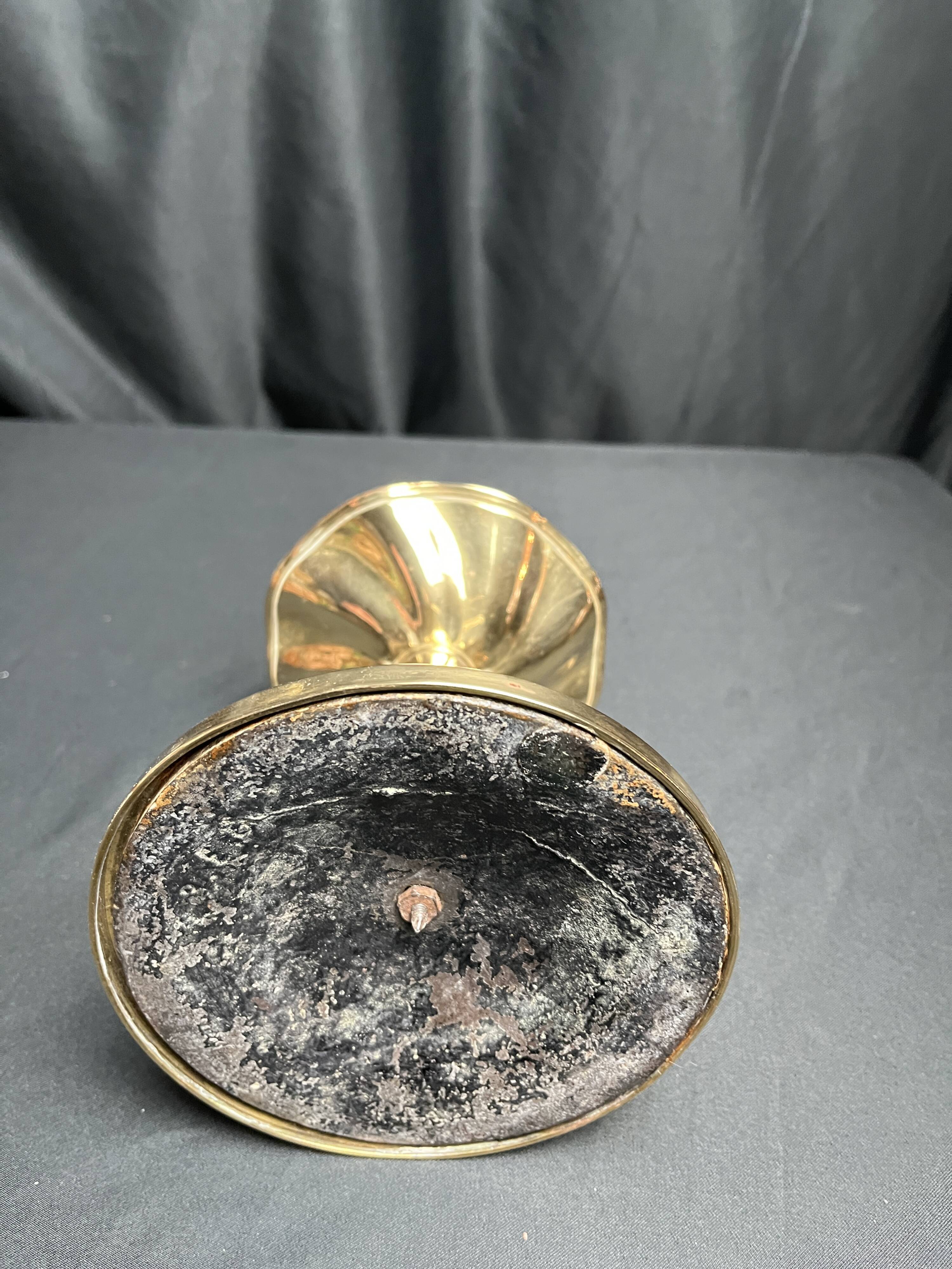 Brass candlestick in a fluted shape from the early 20th century.