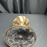 Brass candlestick in a fluted shape from the early 20th century.