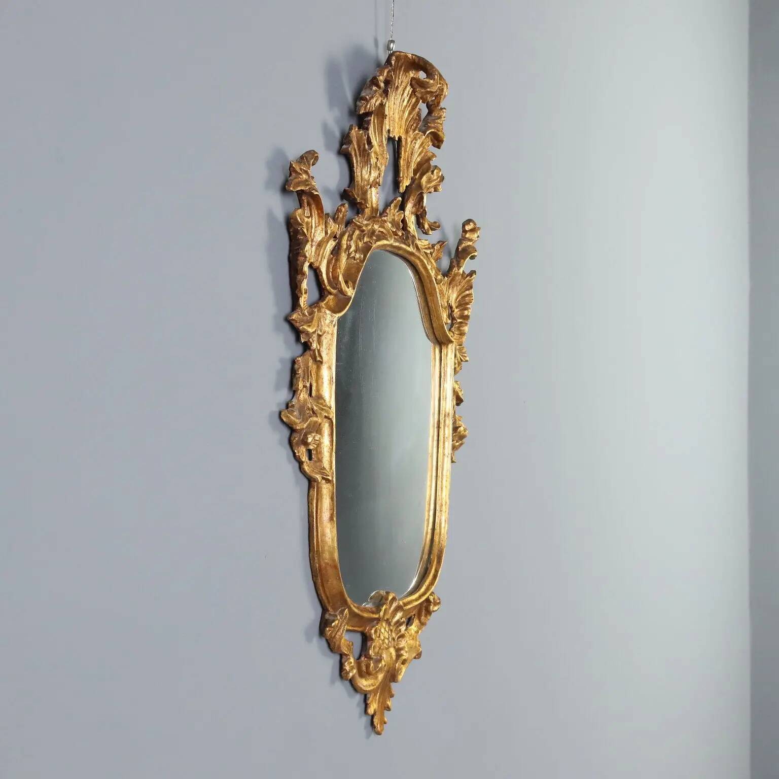 Antique carved and gilded wooden mirror, Italy, late 19th century.