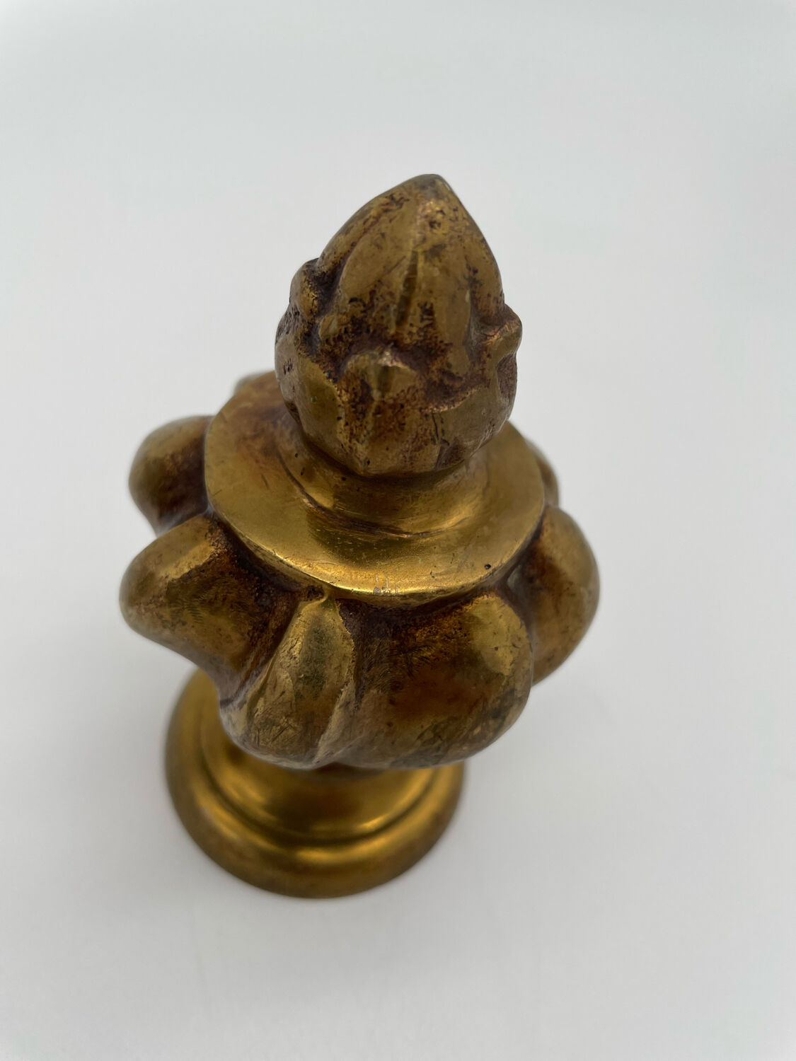 Pair of antique flame curtain rod finials in gilded bronze