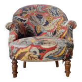 Fauteuil crapaud "Monsieur" tapissé de tissu fleuri ethnique