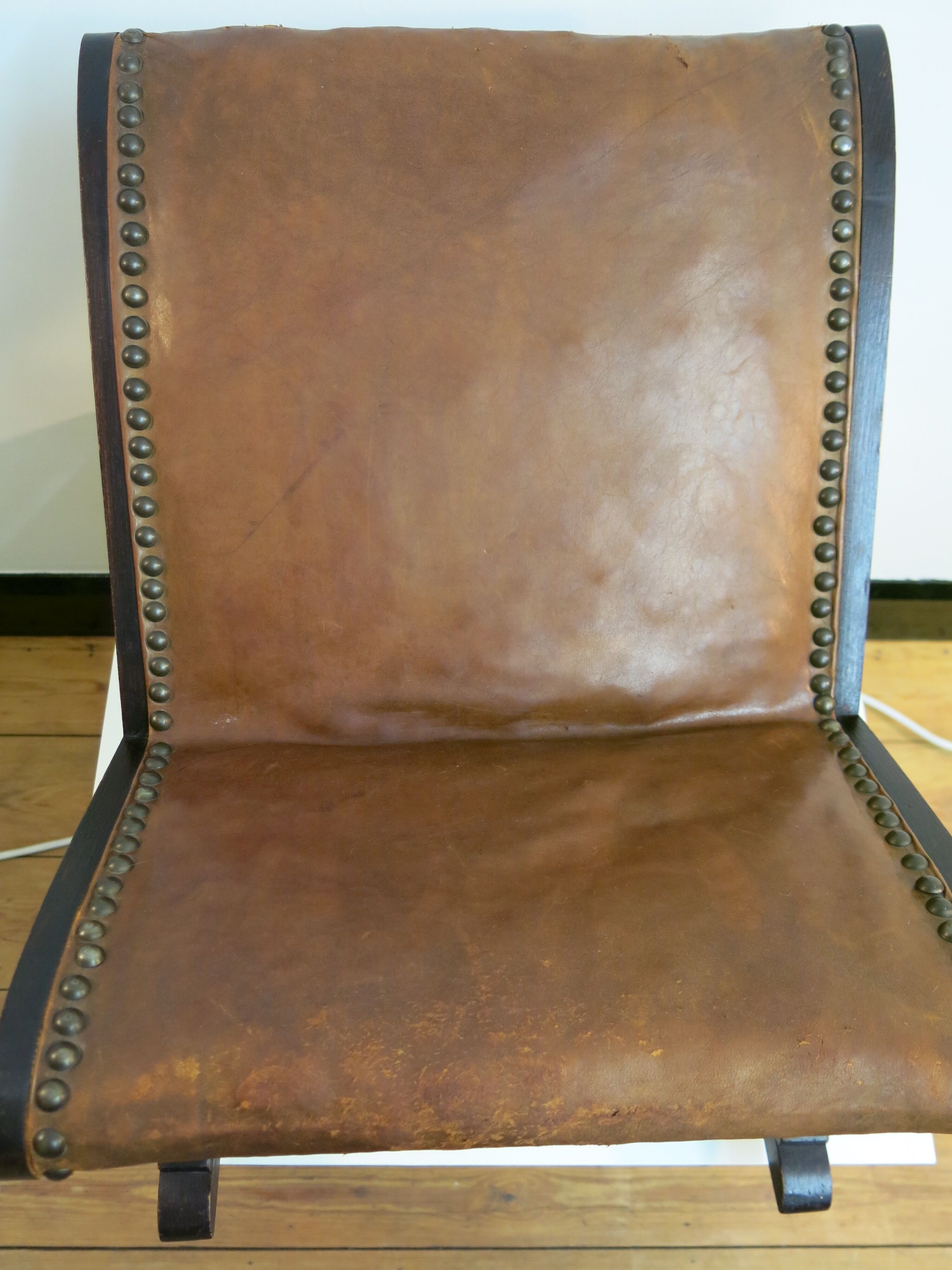 Studded leather rocking footrest