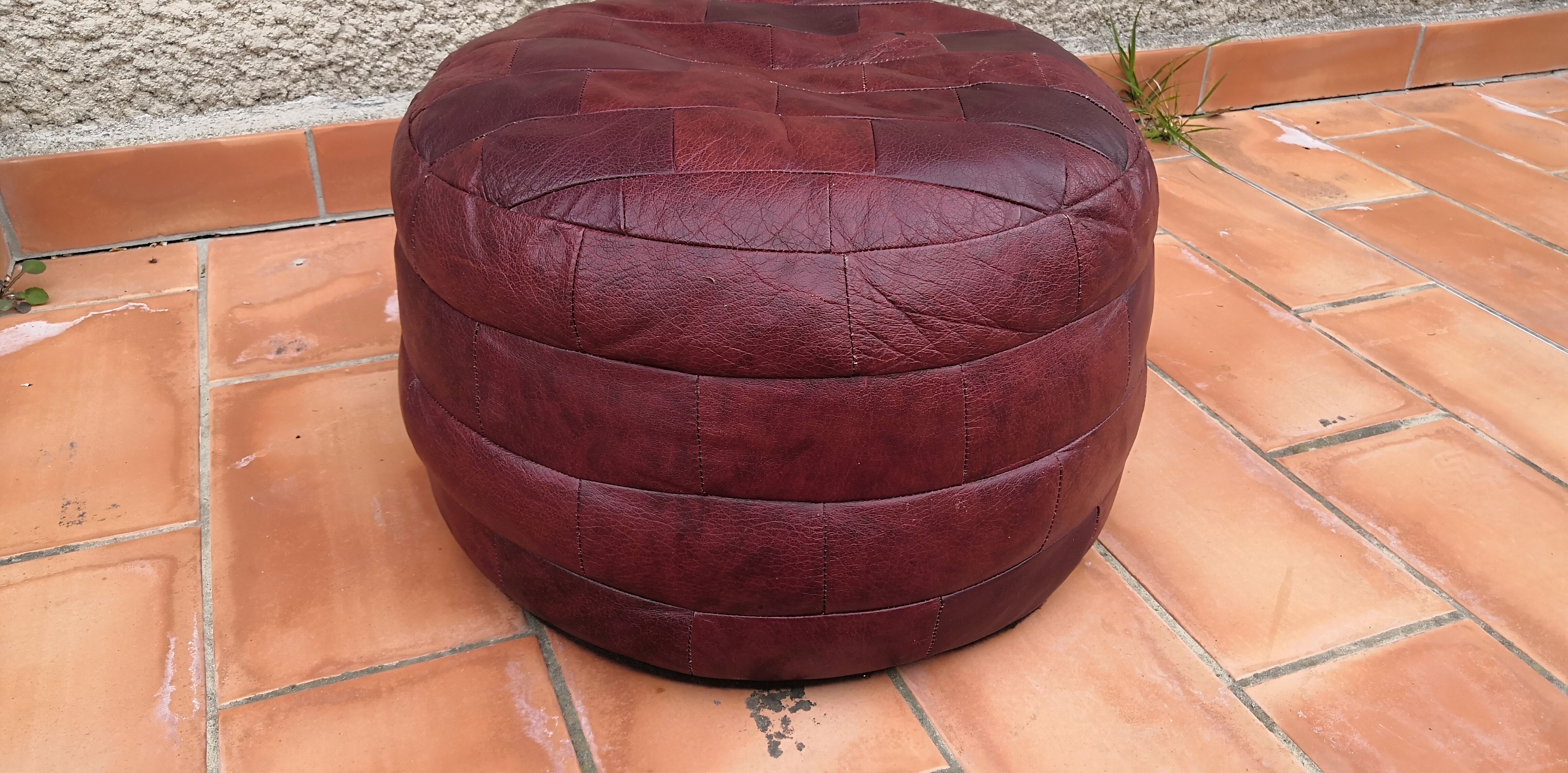 Pair of vintage poufs in burgundy leather patchwork, 1970
