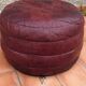 Pair of vintage poufs in burgundy leather patchwork, 1970