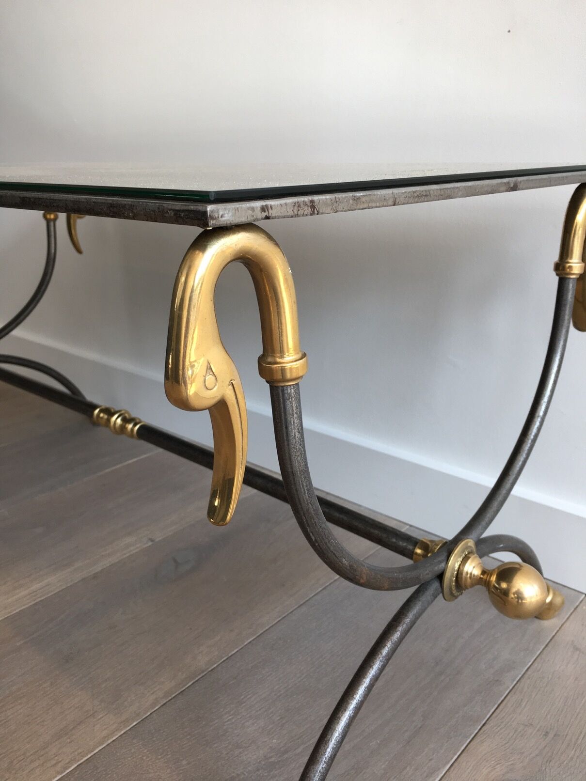 Coffee table in brushed steel and brass