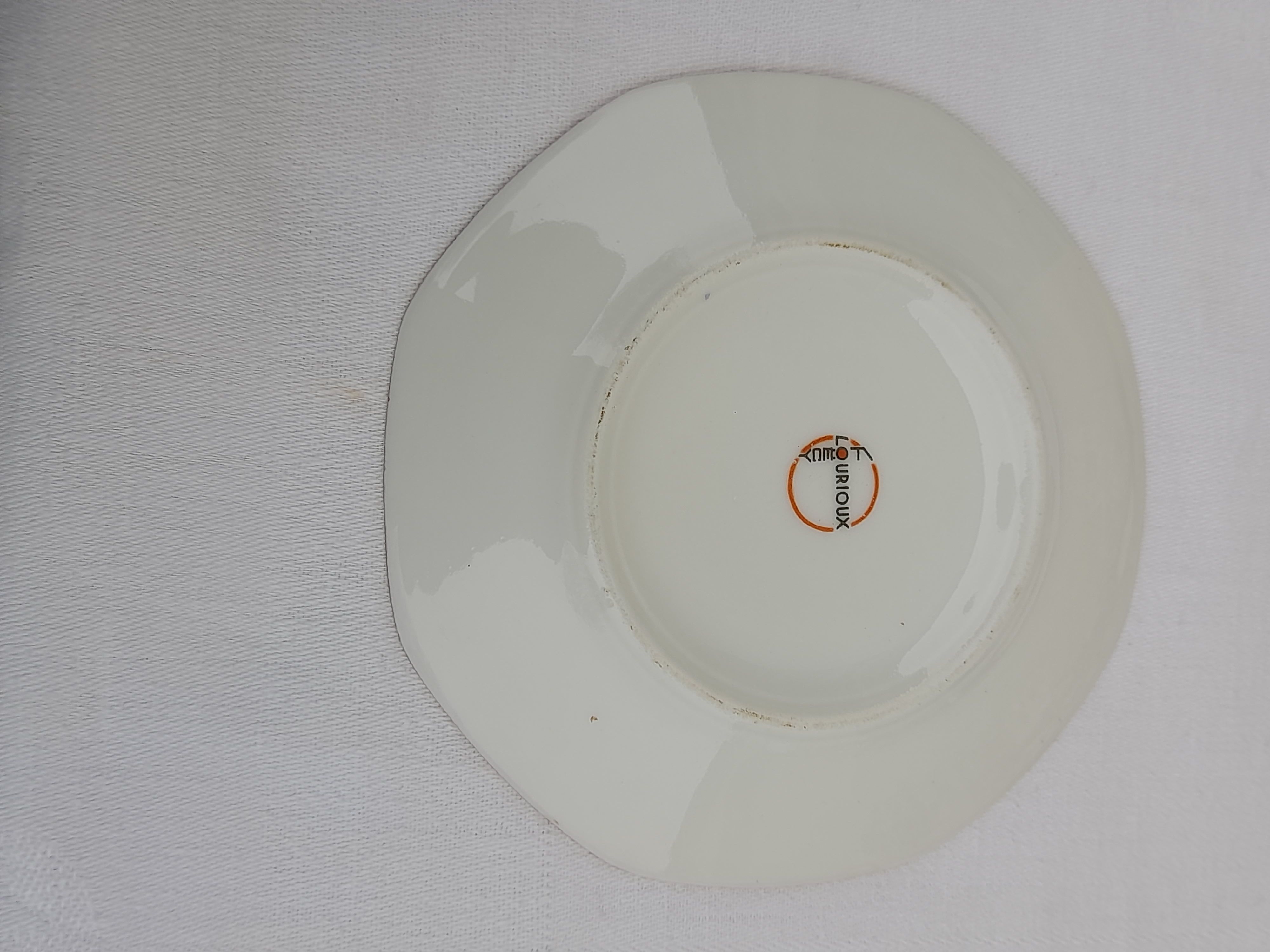 Lourioux Foecy porcelain tea set 12 cups, a sugar bowl and a crèmier