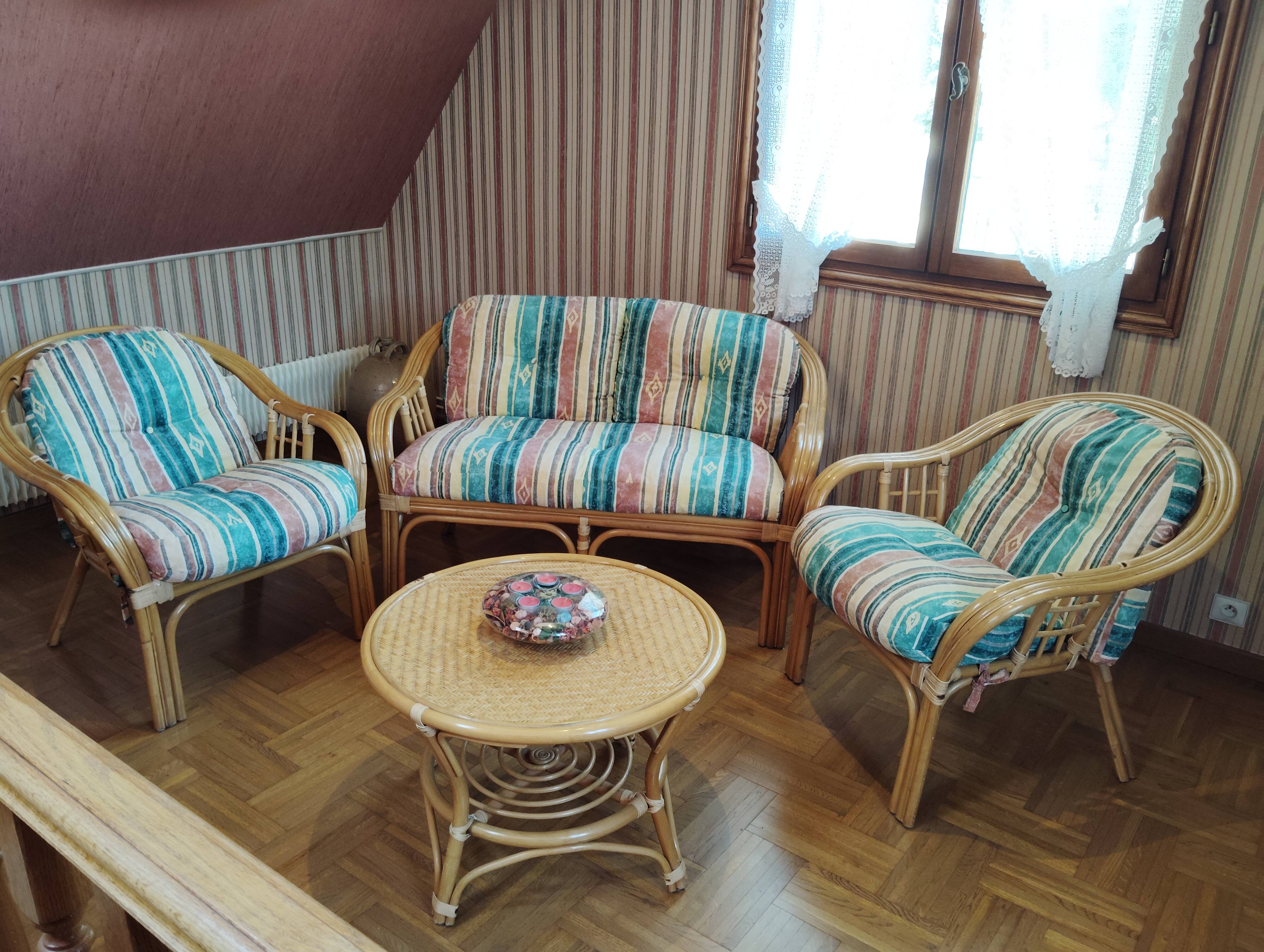 Rattan lounge with removable cushions