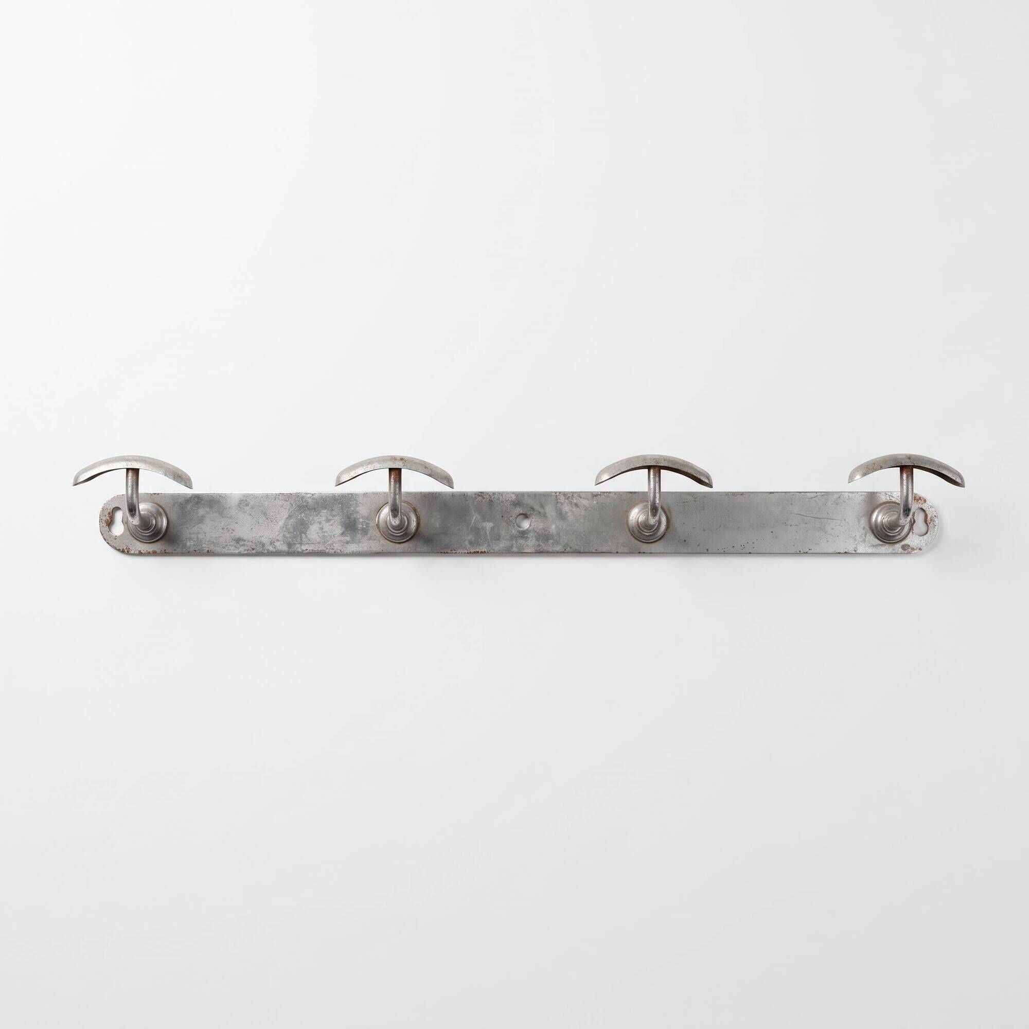 Vintage chrome wall coat rack with 4 hooks, modernist/industrial design.