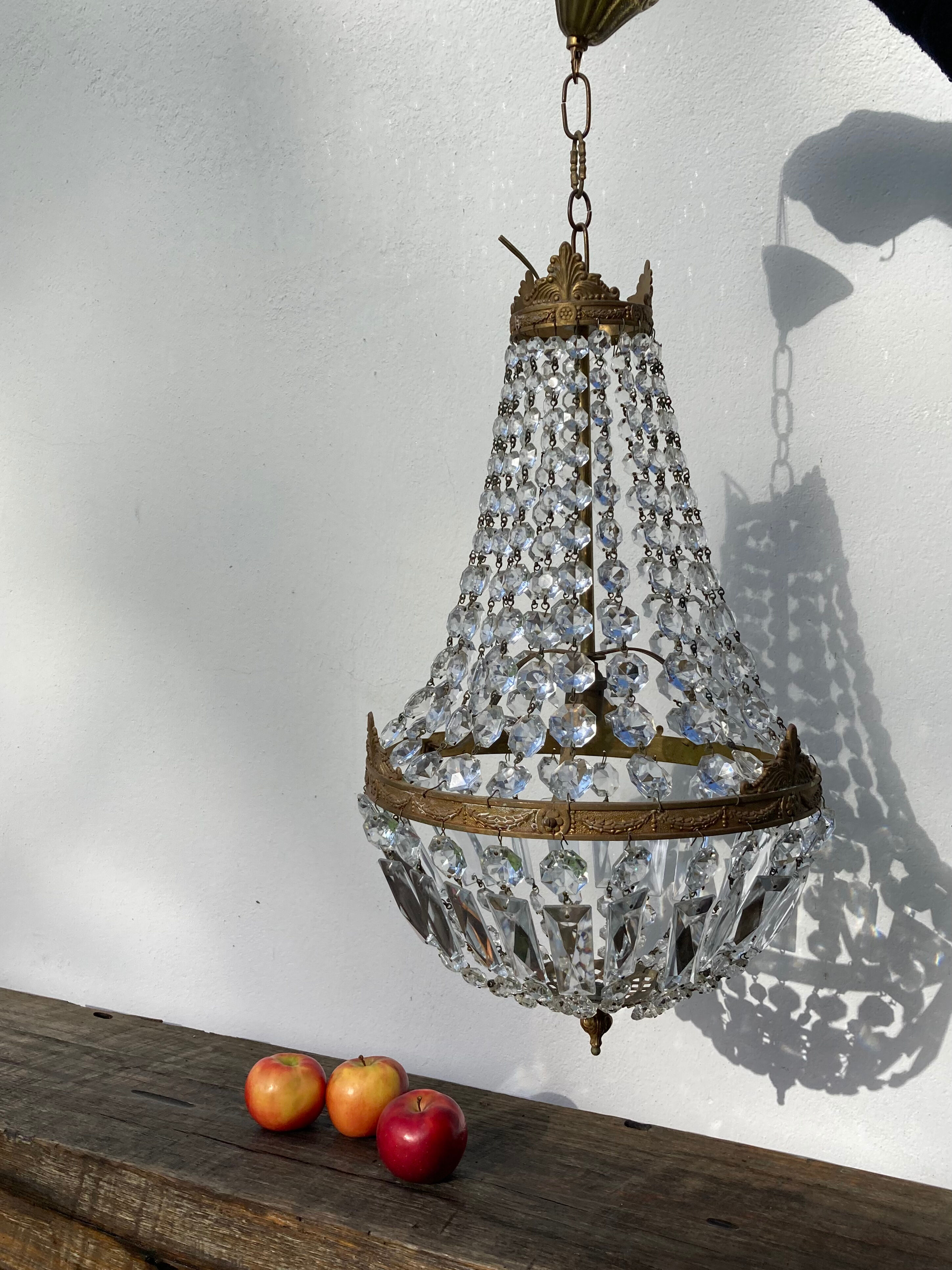 Balloon chandelier with glass crystal and brass tassels in empire style