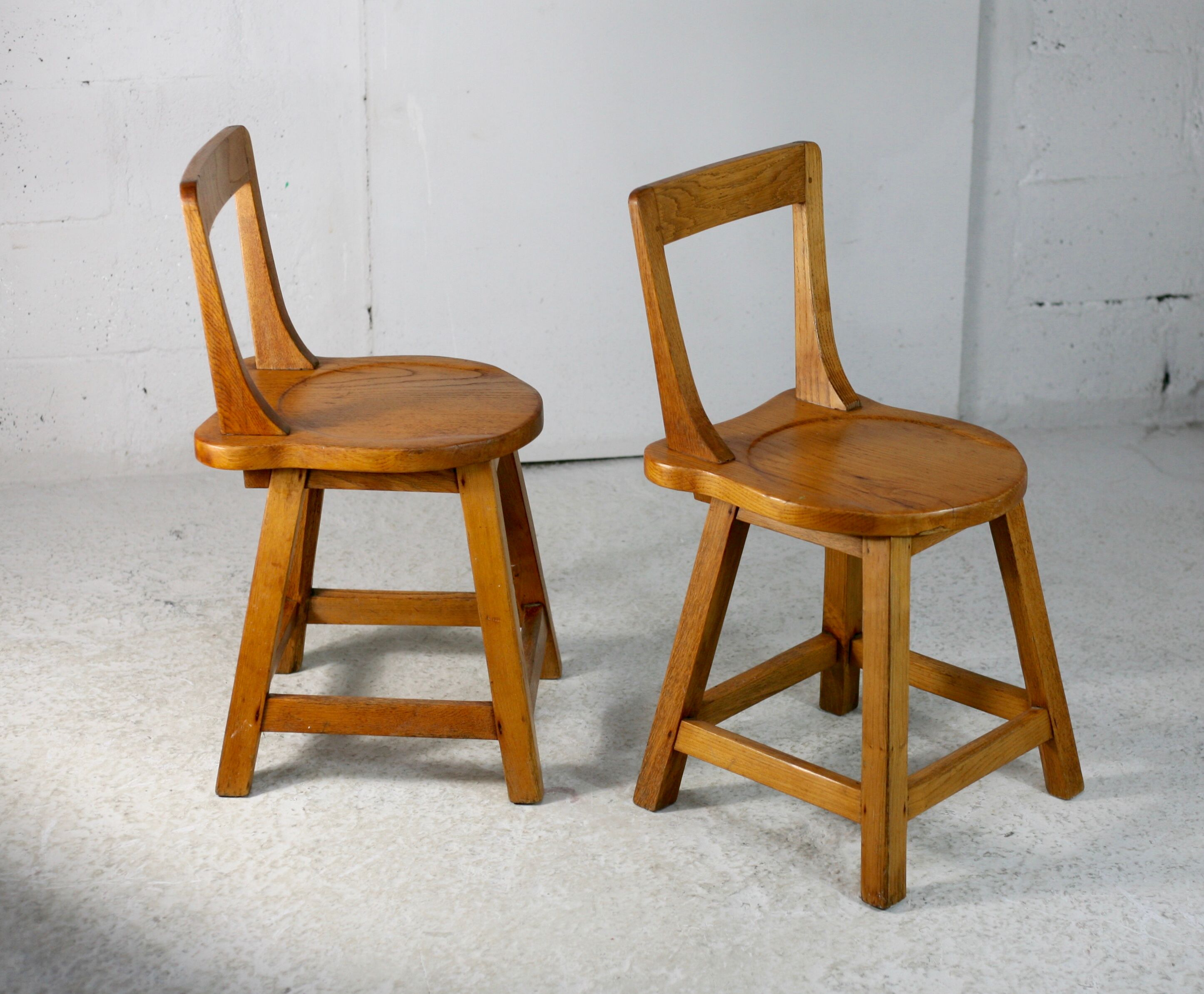Pair of brutalist wooden back stools. France, circa 1960