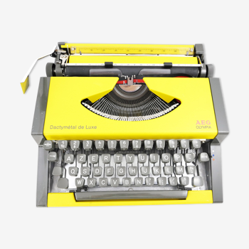 Machine à écrire Olympia AEG Dactymétal De Luxe Jaune révisée ruban neuf avec valise verte