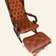 Rocking chair with footrest, wood and tufted leather