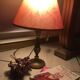 Table lamp at the foot candlestick