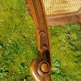 Former seat, wood and caning.