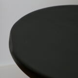Black tripod wooden stool