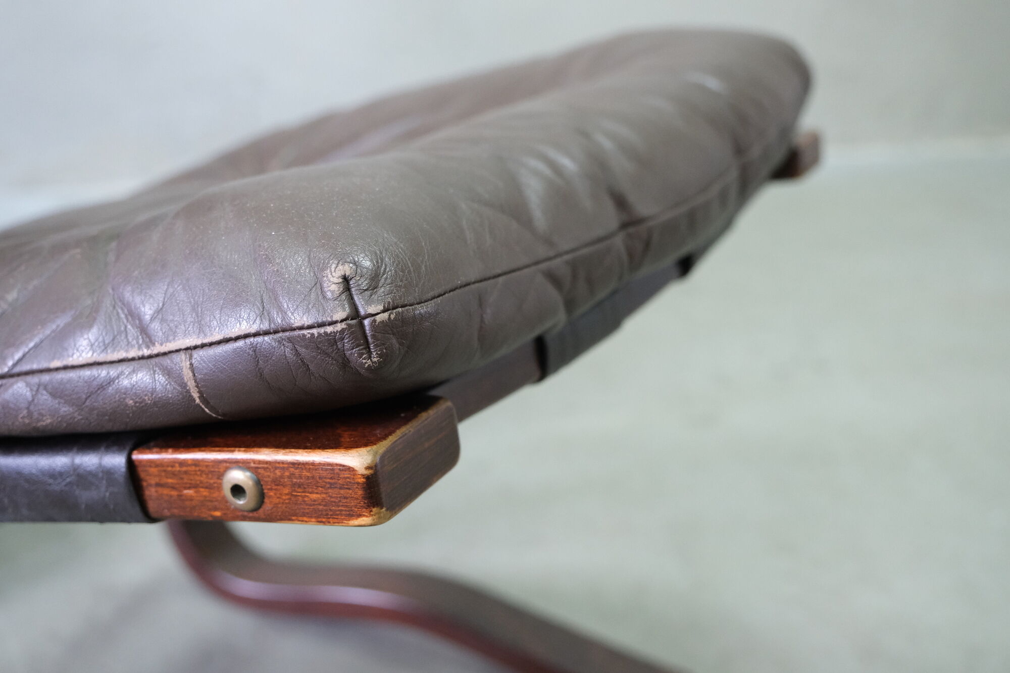 Mid century leather armchair and foot stool by Erda & Nordahl Solheim, Norway 1970's