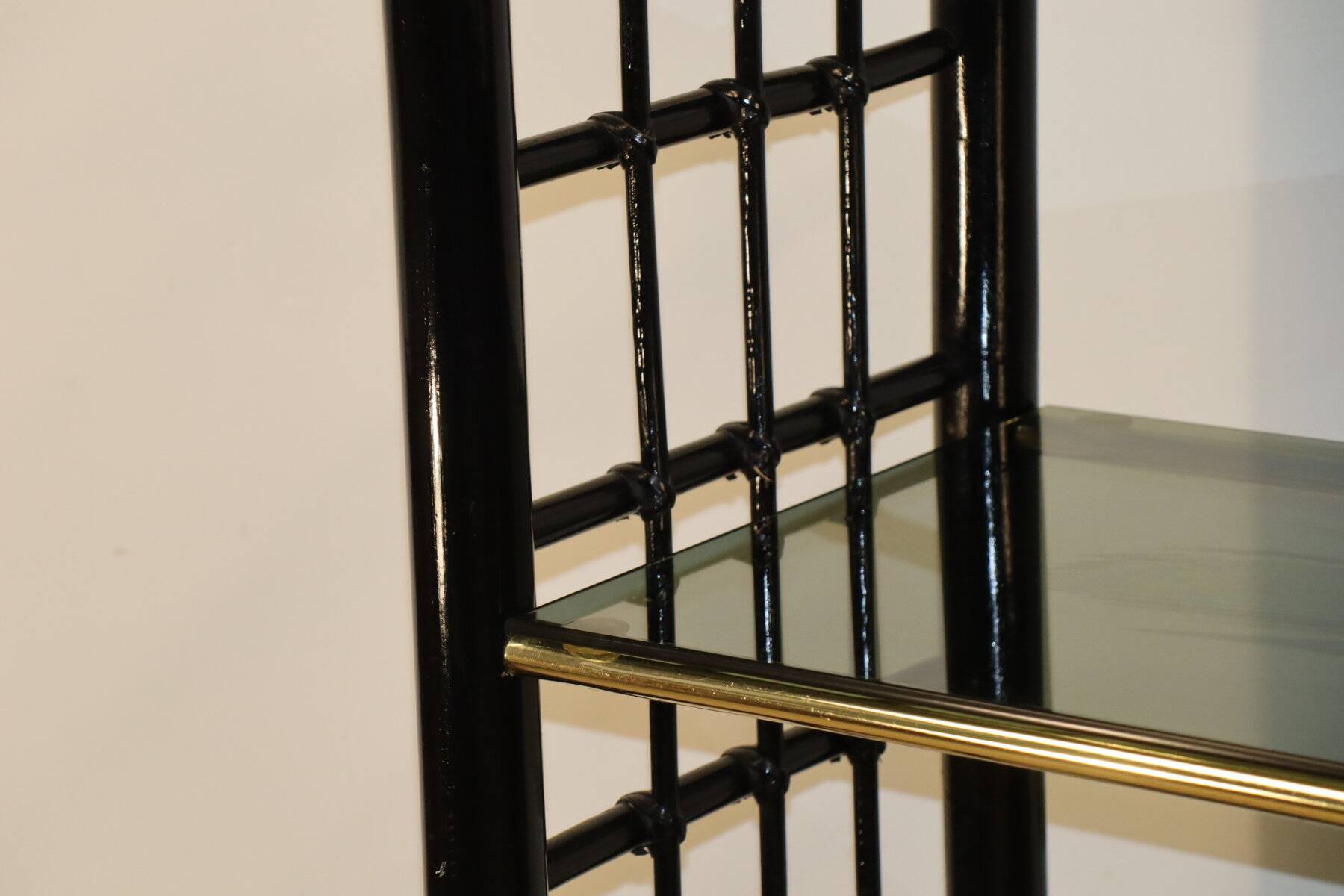 Vintage 1970s shelf in smoked glass with a bamboo-style structure.