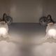 Swan neck wall lights in porcelain, brass and glass - mid 20th century.