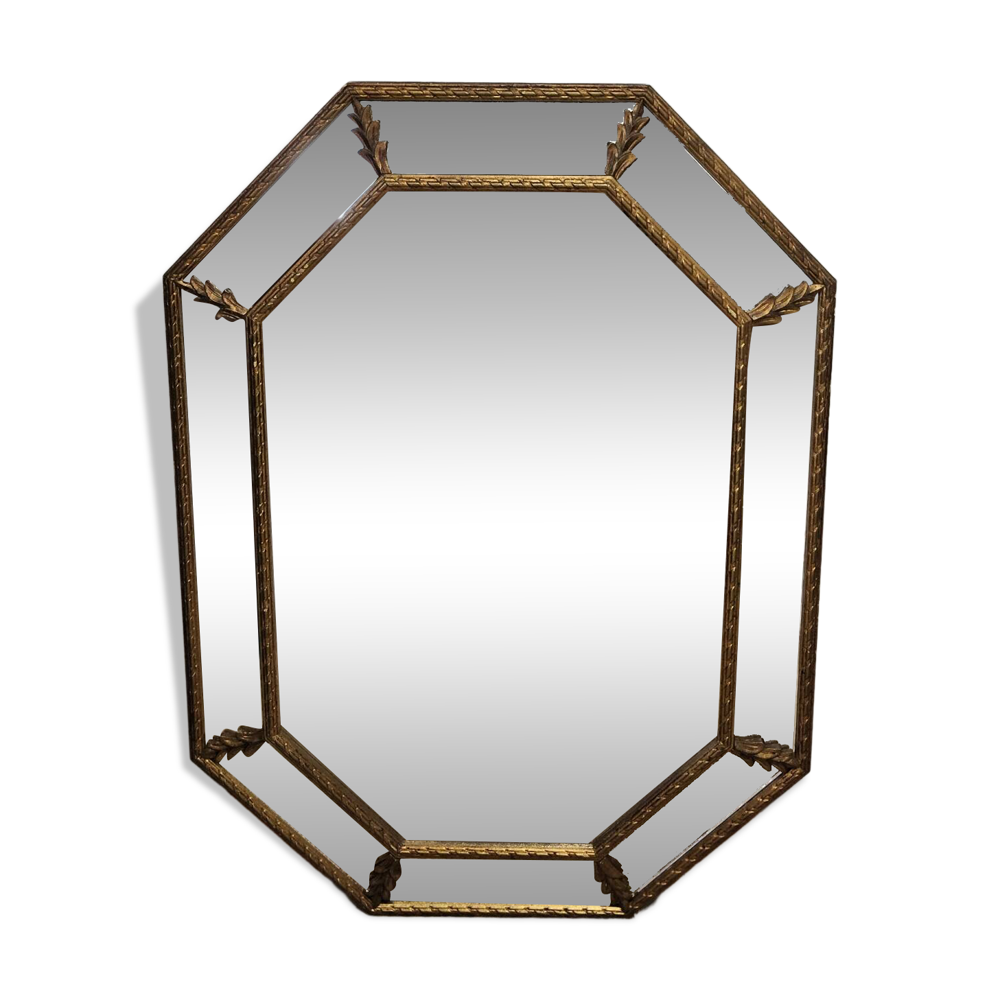 Bevelled mirror with neoclassical parcloses from the 20th century.
