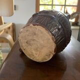 Hungarian folk ceramic pitcher with a brown glossy finish and relief decoration of vine.