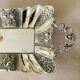 St Louis XV style letter tray, empty pocket, 20th century, in repoussé metal.